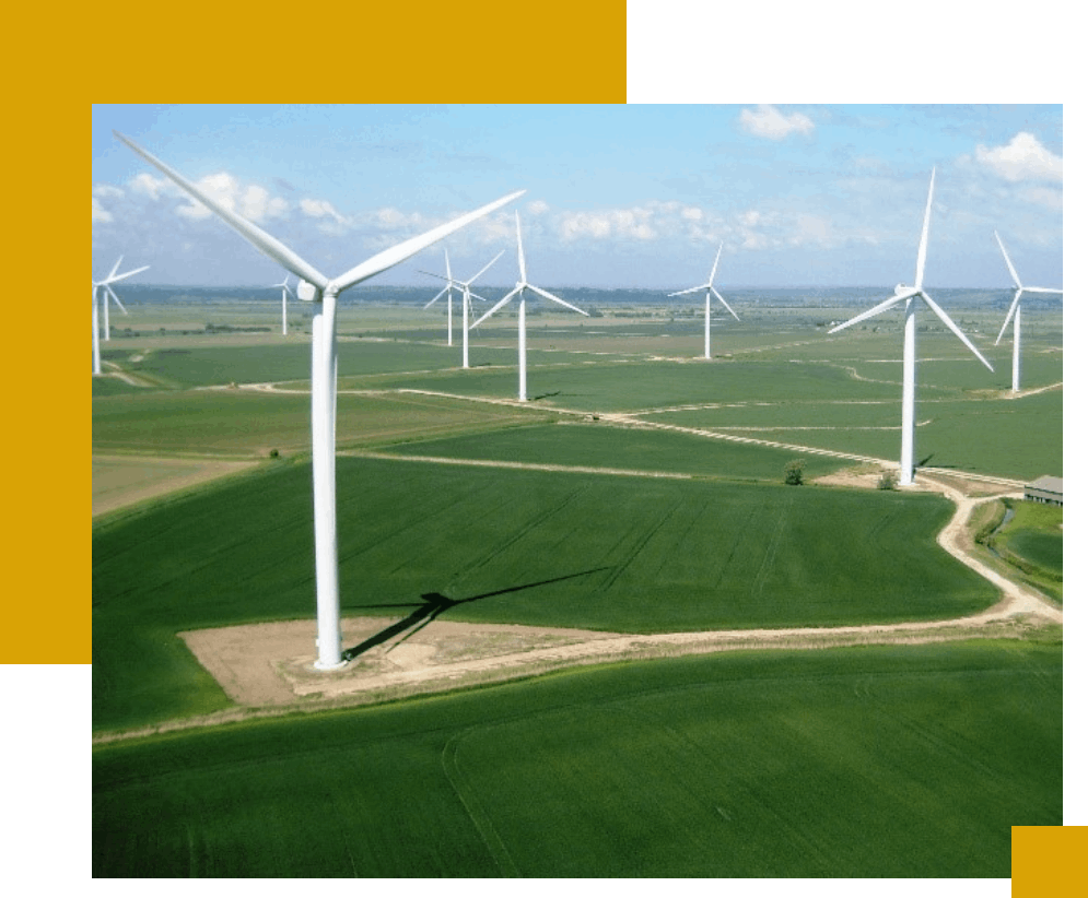 A field with many wind turbines in the middle of it